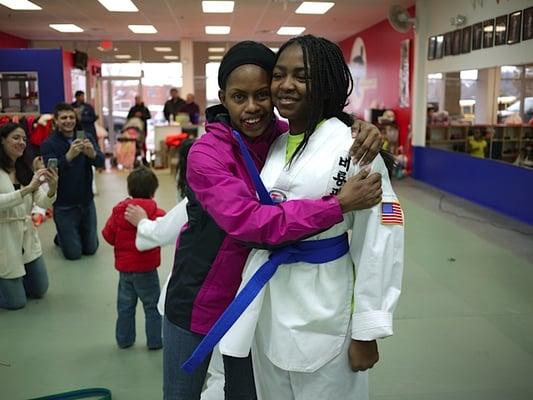 Mom and student after she received her new belt.