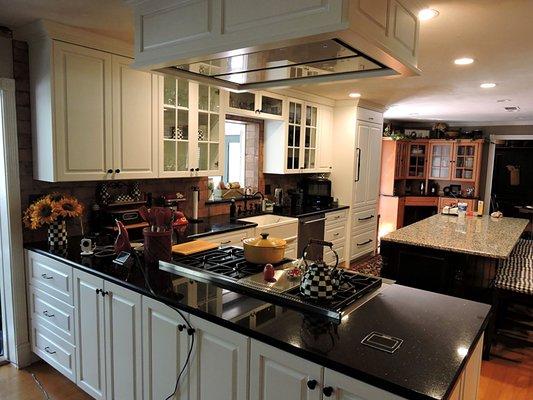 (3 of 3) Kitchen with Island. Sub Zero Refrigerator panels. Custom Hood.