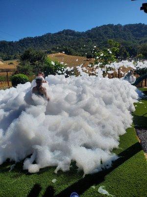 Children playing in foam created by OMG! Foam Parties