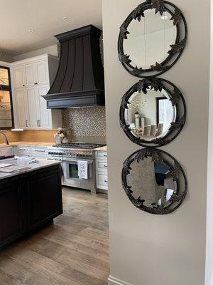 Nathaniel recommended this mirror be hung on this wall to help the eye and mind process the transition from one room to the hallway.