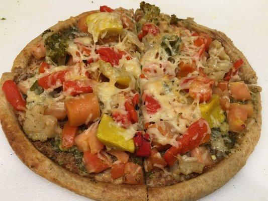 Pesto Quinoa Pizza made from freshly ground whole grains, fresh vegetables, quinoa, roasted red peppers, parmesan cheese