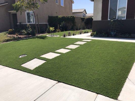 American made Greenridge installed in the Jurupa Valley with curbing and Arizona River rock.