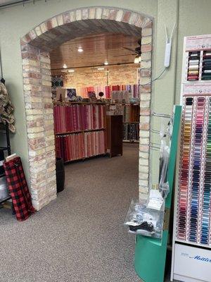 View of fabric through a brick arch