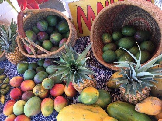 Big mangoes, papayas, pineapple, bananas, sour fruit.