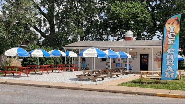 The outdoor dining area. Featuring a walk up window and outdoor games for the family.