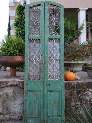 How about some unusually tall fabulous chippy distressed aqua green doors? What a rare find.