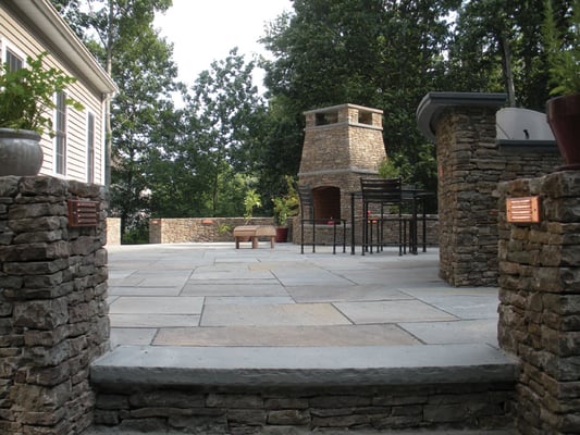 Pennsylvania fieldstone walls, grill, and fireplace; natural cleft bluestone patio