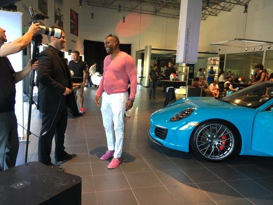 Interviewing a Porsche customer at an unveiling event.