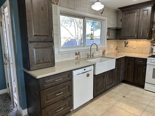 Cabinets, wall tile, sink, floating shelves