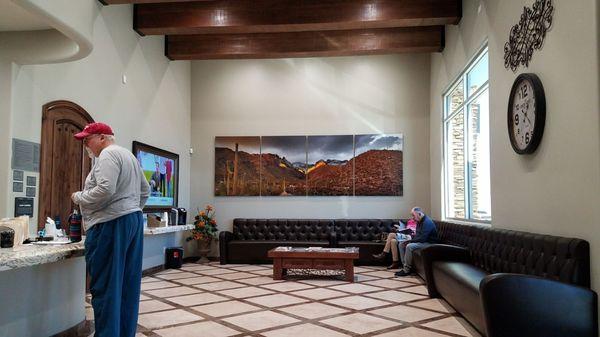 Front desk waiting area with complimentary coffee and water!