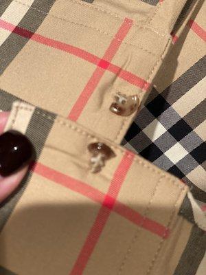 Shattered buttons on my brand new, never worn Burberry shirt, grrrr.