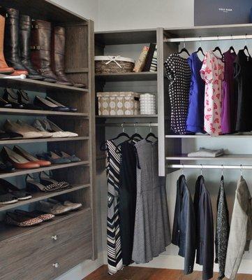 Shoe storage in walk-in closet in Driftwood woodgrain color