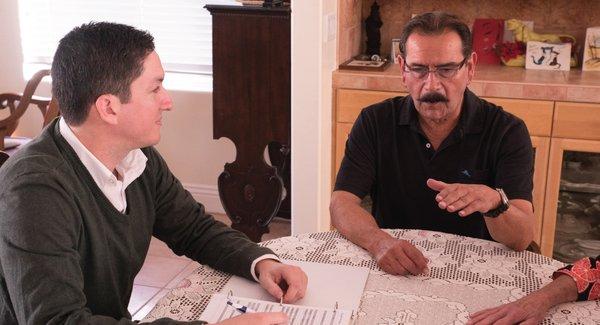 Second Home co-founder Mike Acuna discussing senior housing options with client