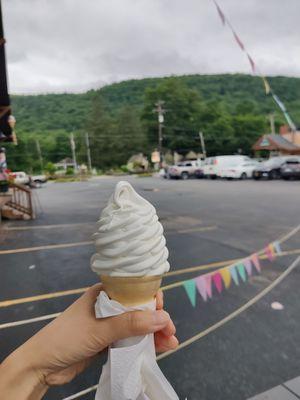 Baby vanilla soft serve on a cone