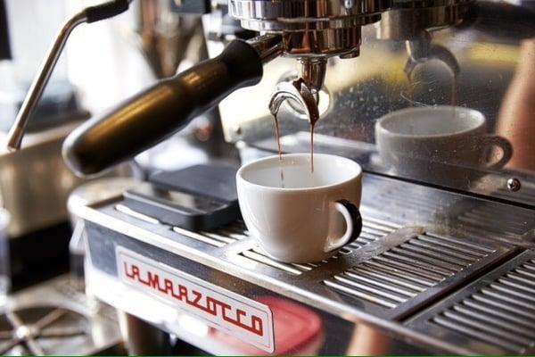 Pulling espresso shot.