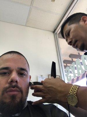 Getting cleaned up by the best barber in the bay