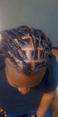 Dreadlocks extensions, neat, painless and excellently done.