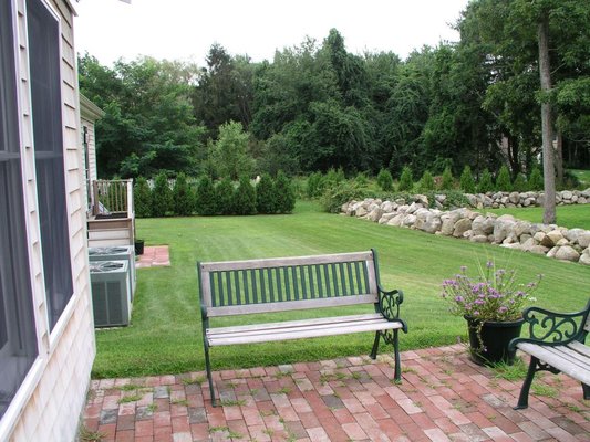 Peaceful back patio to sit and relax while doing your laundry!