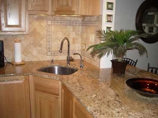 Granite with tile backsplash