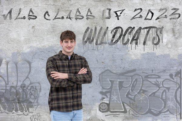 Senior portrait with fake grafitti added