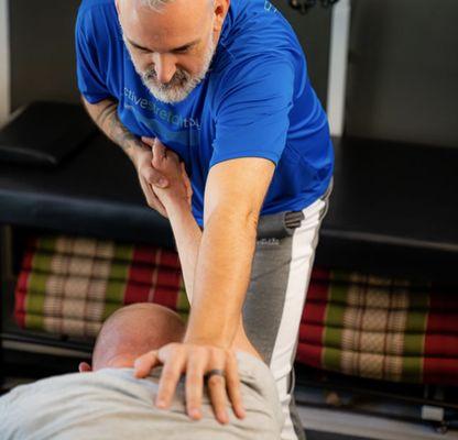 Opening the shoulder with gentle traction and client activation techniques to help break out fo flexed posture patterns.