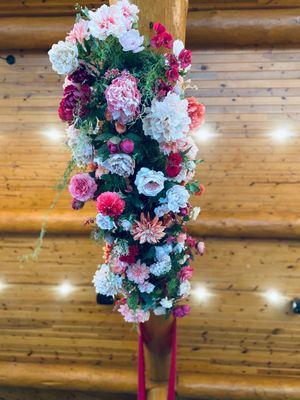 I LOVE this ceiling drop!  This incredible showcase of flowers is suspended from one of the beams in the venue.  What a state piece!