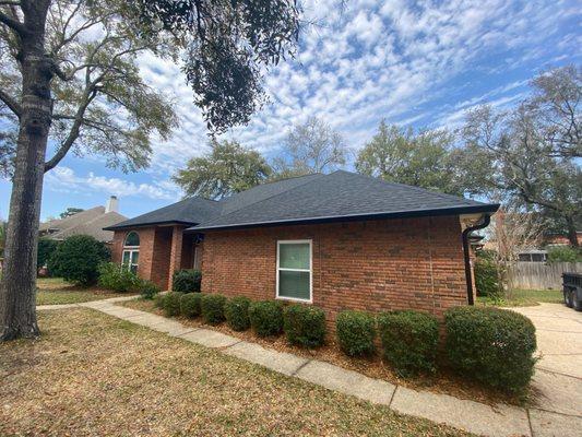 Black gutters from Suncoast Overhead Solutions, Black roof from Story & Bleich Roofing