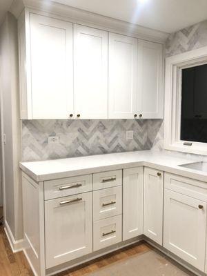 tile work, new flooring, custom cabinets, quartz counters, paint, handles, appliances