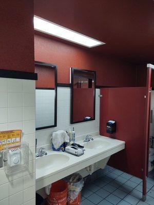 Local restaurant remodel, phase 2: the mirrors are up, trim at top of tile as well.