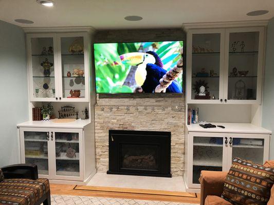 In-set tv mounting on custom stone fireplace