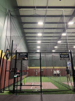 Batting cages with pitching machines