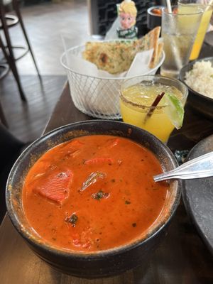 Chicken Tikka Masala. Mojito mock tail and garlic naan in the background