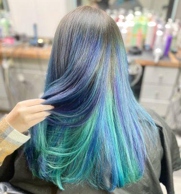 Mermaid vibes for sure with this purple, teal and indigo hair color!