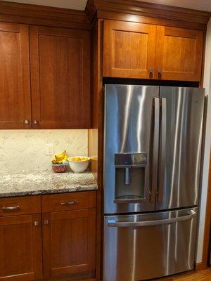 They beautifully built the cabinets around our new refrigerator.