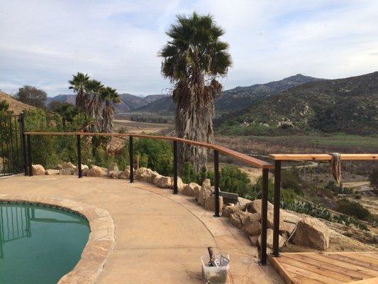 Pool area same cedar deck area