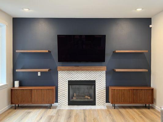 Fireplace - custom shelving, tile work, lighting.