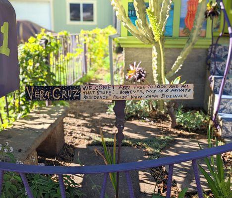 Welcoming signage and polite request to please stay on sidewalk