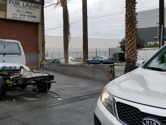 Shop 2 the left & my car sitting across the street . He's had my car for a week now after finding out he had been paid.