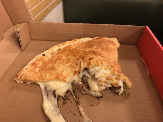 The calzone was full of cheese and meat. This is only half of it.