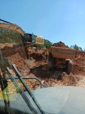 Dozer loading dump truck  in Angier N.C.