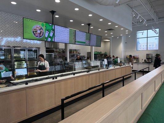 The salad assembly line with the menu above...