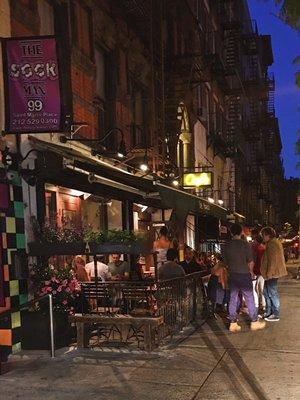 Sidewalk seating. Evening time