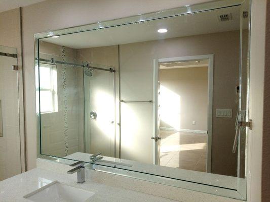 Bathroom mirror with bevels.