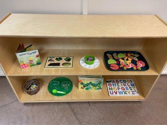 Example of a shelf of work in the toddler classroom