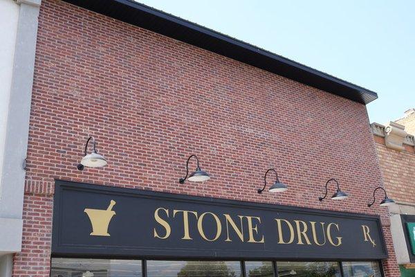 Custom Signage
 A 1980's building received a face lift. Complete with custom signage handcrafted "STONE DRUG" by Quentin Dally.