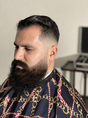 Skin mid fade beard lined up