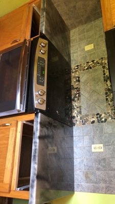 Custom epoxy countertop surrounding a stove