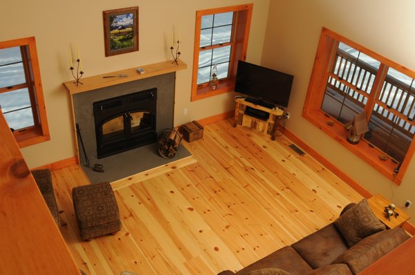 Michigan Red Pine Flooring adds coziness to this log home