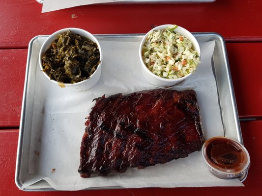 Half rack of ribs with cole slaw, collard greens, and husband took my garlic Texas toast.