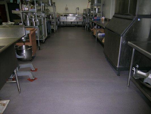 Seamless commercial kitchen flooring resists bacteria and holds up over time.